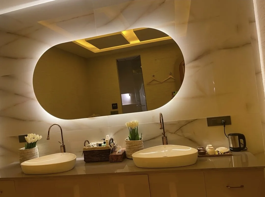 Illuminated double basin and mirror amenities at Spa Paris Luxury